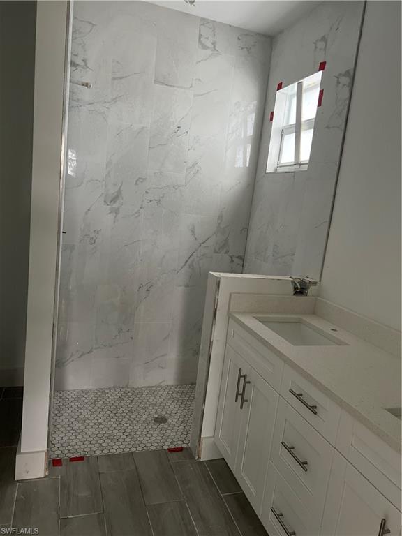 335 Ranch Avenue Lehigh Acres, FL 33974 - Photo 7 of 24 a bathroom with a shower