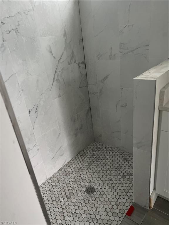 335 Ranch Avenue Lehigh Acres, FL 33974 - Photo 8 of 24 a bathroom with a shower