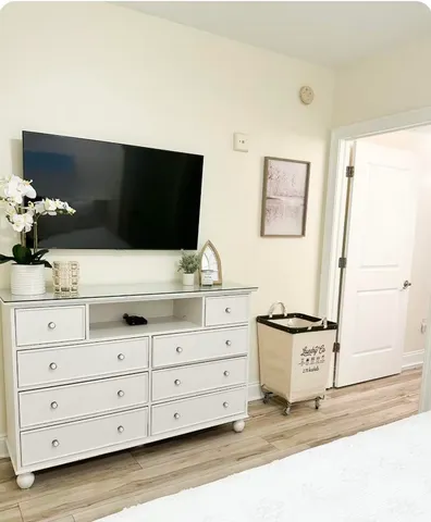 a bathroom with a toilet and a shower curtain