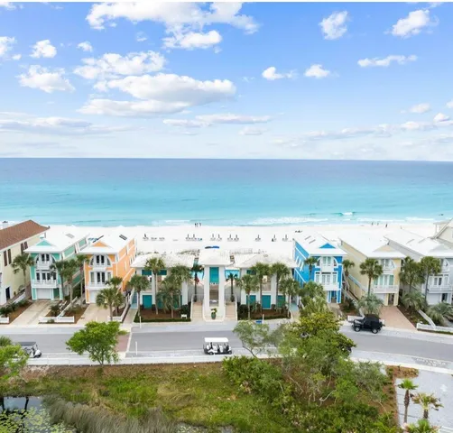 a aerial view of a house with garden space and a patio