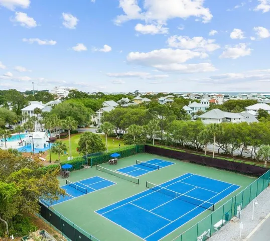 a view of a house with a yard and deck