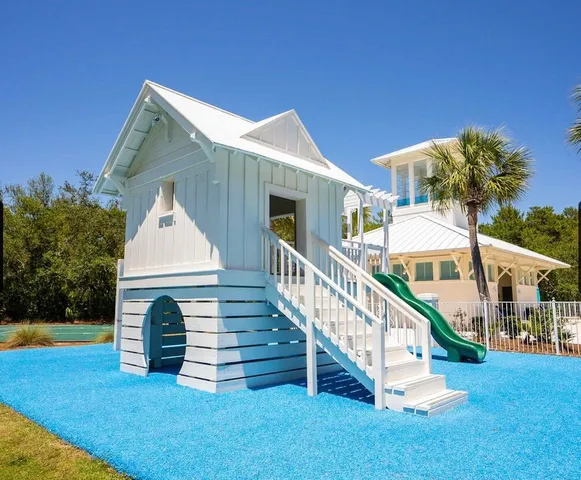 an aerial view of a house yard swimming pool and outdoor seating