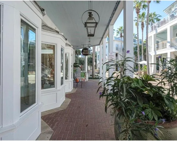 an aerial view of a house yard swimming pool and outdoor seating