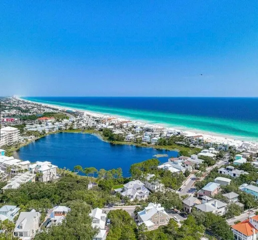 a view of a patio with table and chairs and potted plants