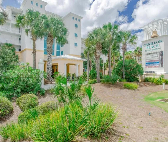 a view of a patio with table and chairs and potted plants