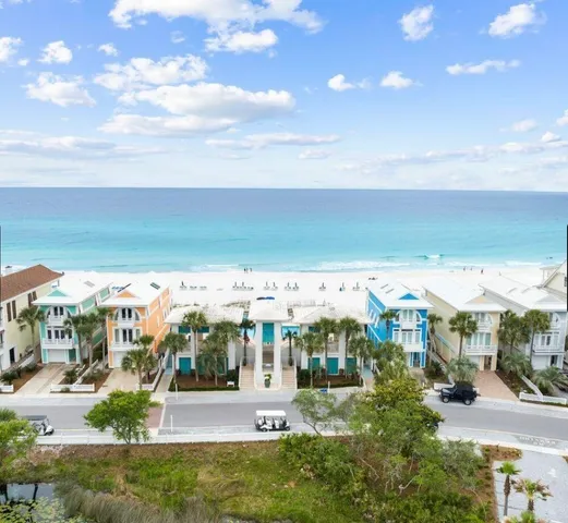 a yellow house with trees in front of it