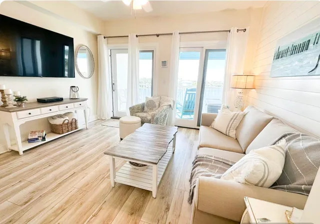a living room with furniture fireplace and flat screen tv