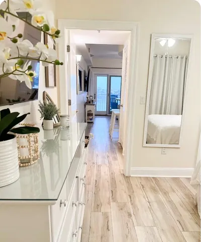 a view of a dining room with furniture and wooden floor