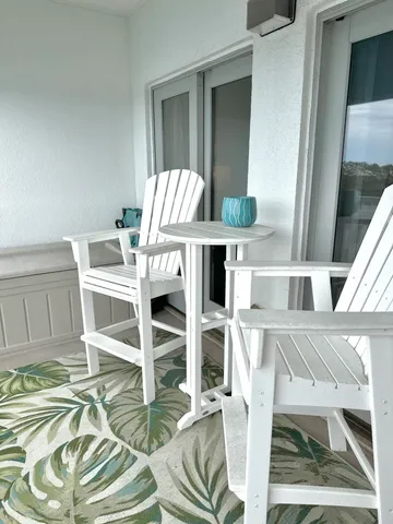 a view of balcony with furniture