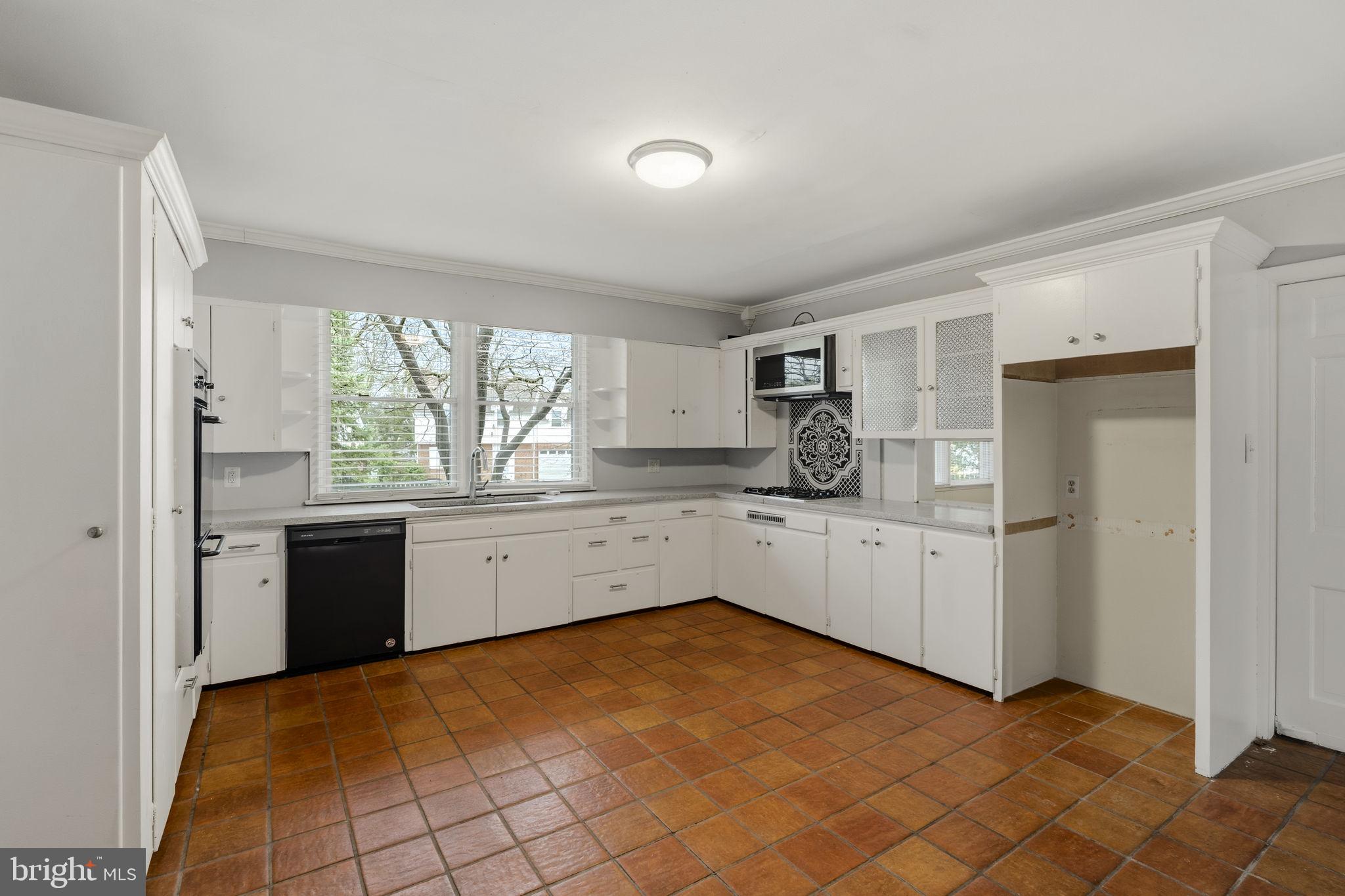 2301 Edgewood Road Harrisburg, PA 17104 - Photo 14 of 63 a kitchen with a cabinets and white appliances