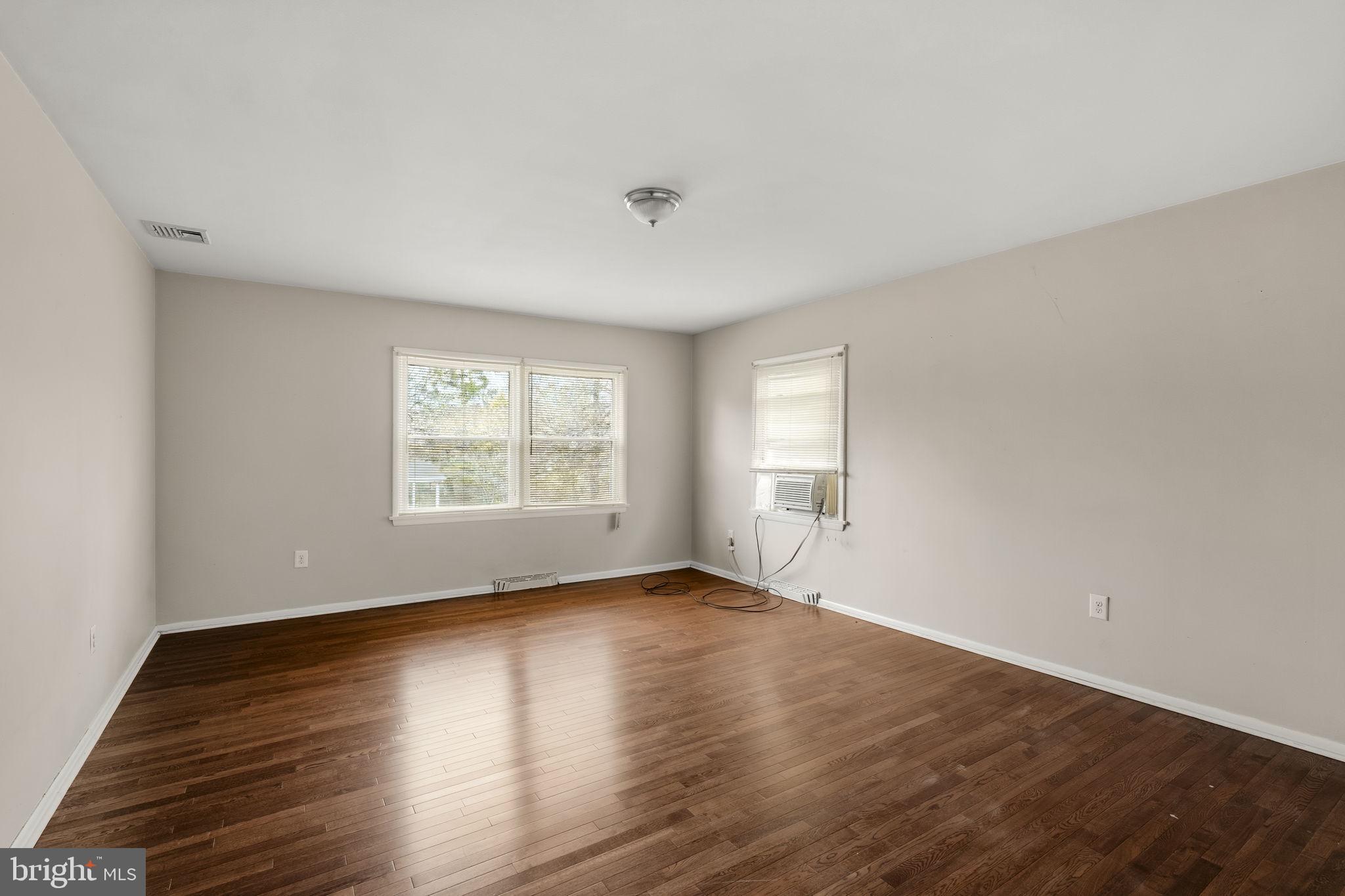 2301 Edgewood Road Harrisburg, PA 17104 - Photo 20 of 63 an empty room with wooden floor and windows