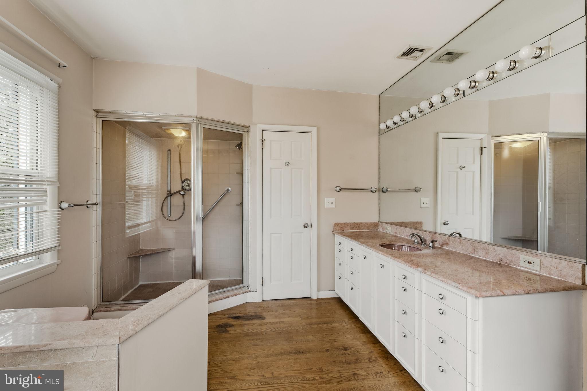 2301 Edgewood Road Harrisburg, PA 17104 - Photo 23 of 63 a bathroom with a granite countertop sink mirror and shower