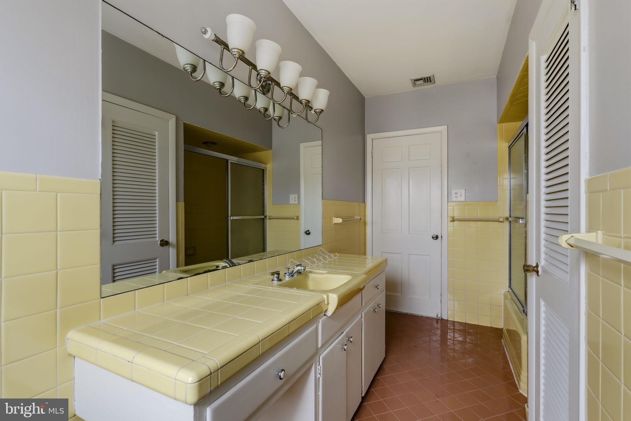 2301 Edgewood Road Harrisburg, PA 17104 - Photo 30 of 63 a bathroom with a sink a vanity and a mirror