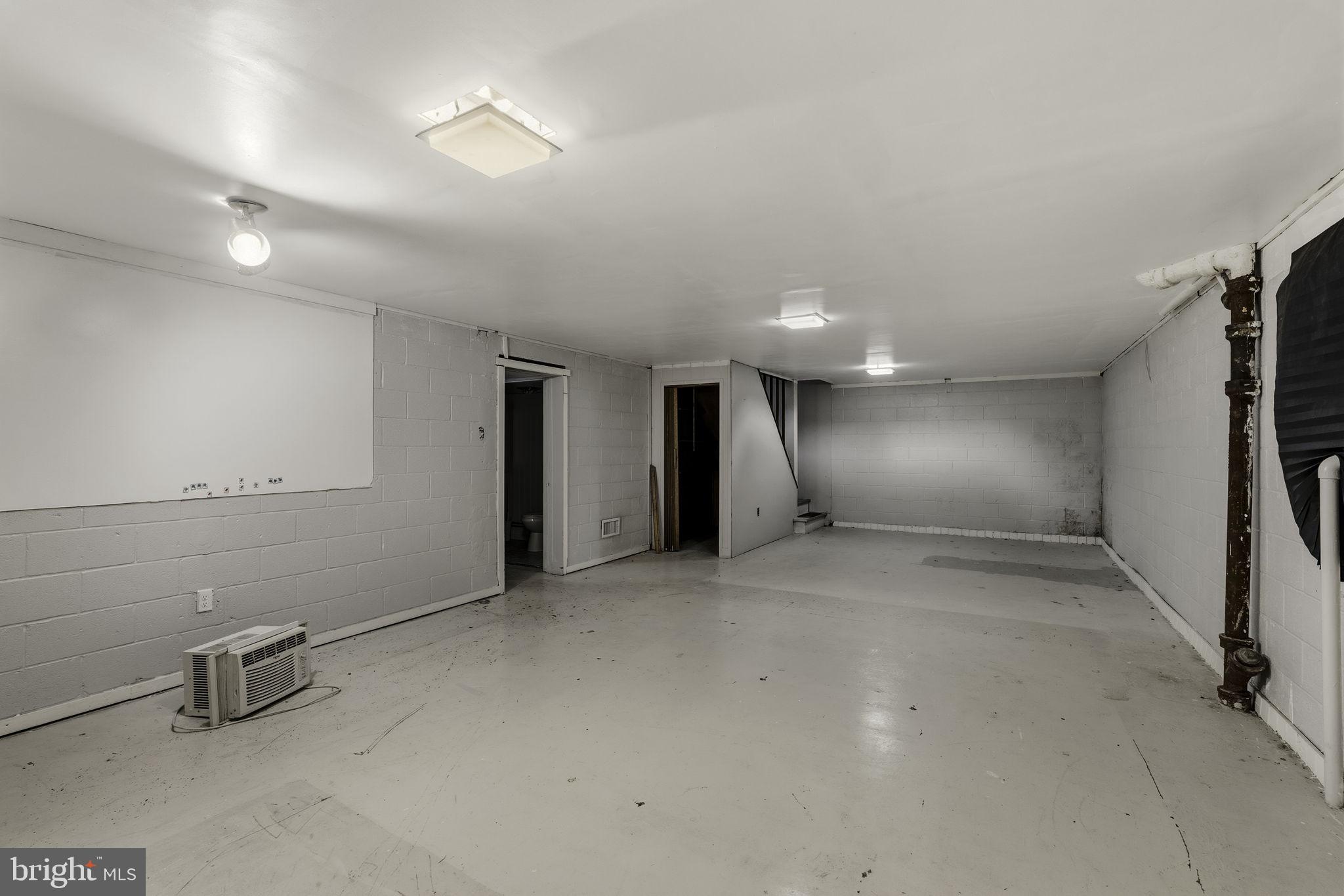 2301 Edgewood Road Harrisburg, PA 17104 - Photo 32 of 63 an empty room with a empty space and windows