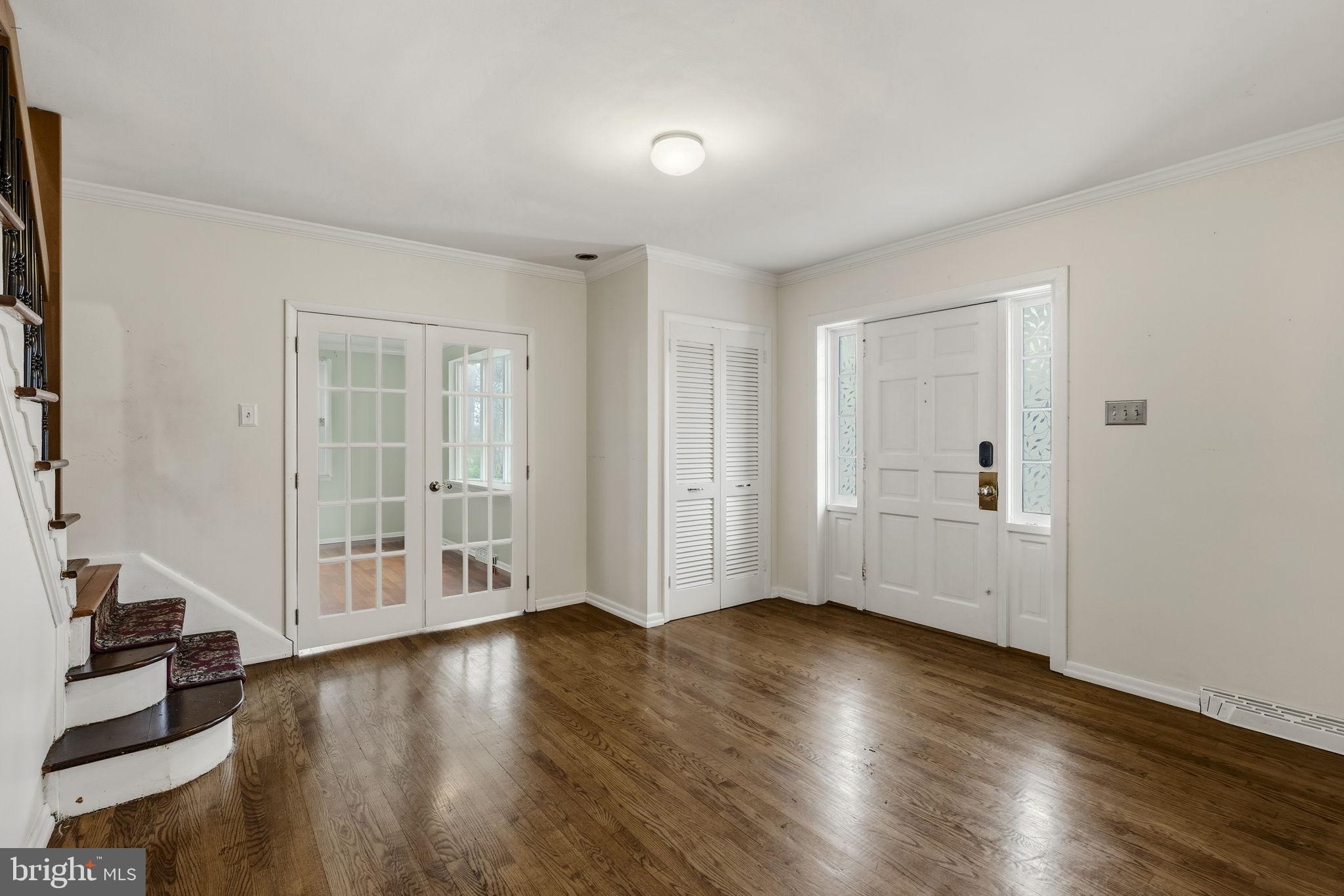 2301 Edgewood Road Harrisburg, PA 17104 - Photo 6 of 63 an empty room with wooden floor and windows