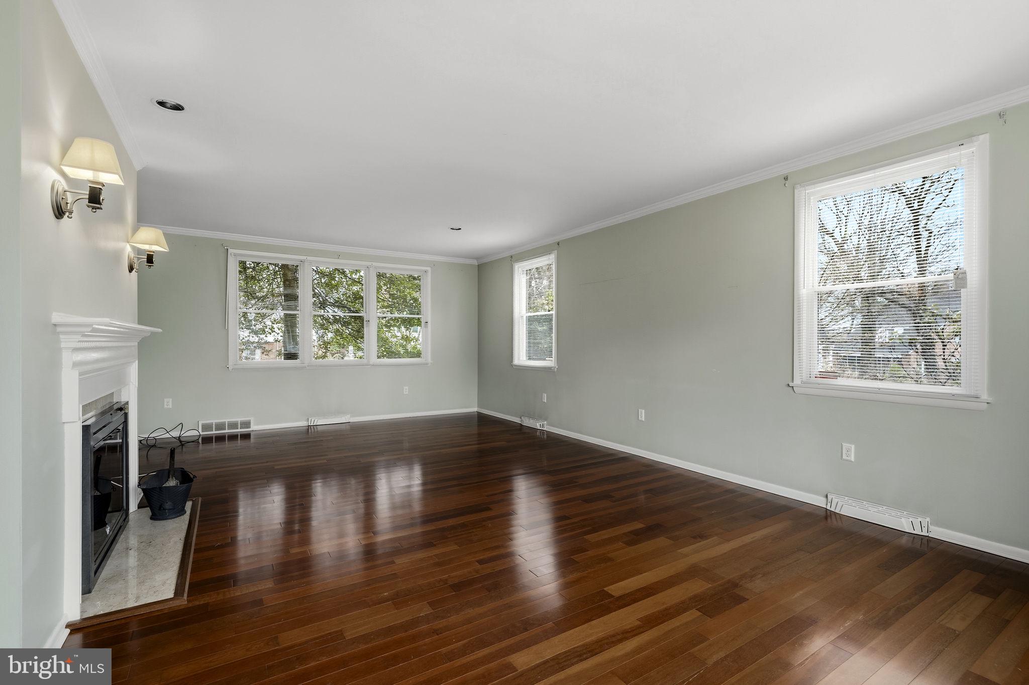 2301 Edgewood Road Harrisburg, PA 17104 - Photo 7 of 63 a view of an empty room with wooden floor and a window
