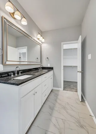 a white bath tub sitting next to a shower