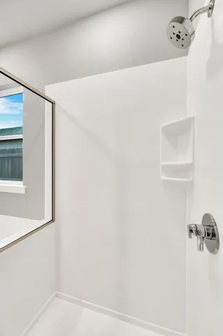 a view of a room with shelf on the wall