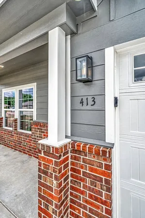 a front view of a house with a large window