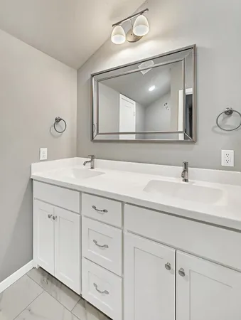 a bathroom with a shower and a sink