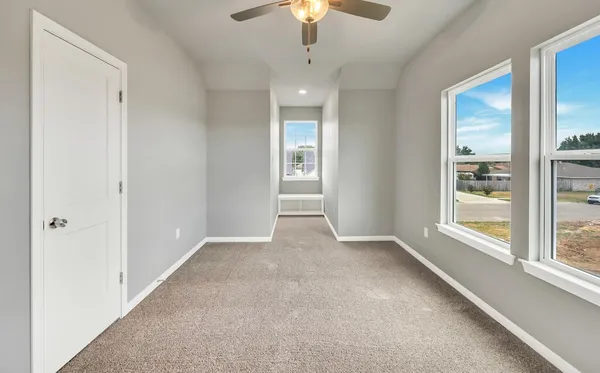 a view of an empty room with a window