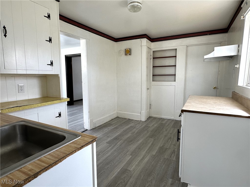 1535 Niles Road Southeast Warren, OH 44484 - Photo 7 of 13 Kitchen featuring white cabinetry, and a sink