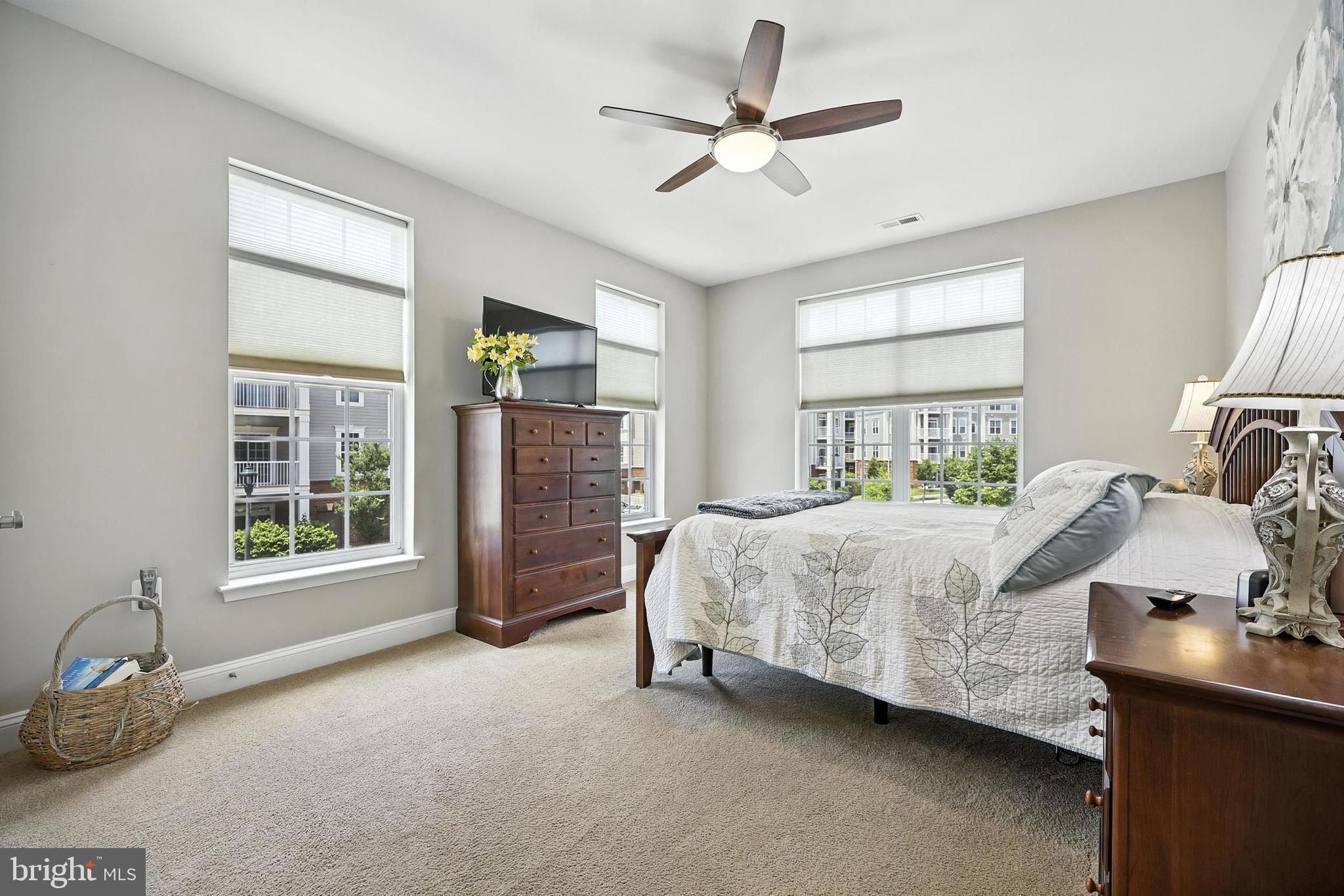 3910 Doc Berlin Drive, Unit 21 Silver Spring, MD 20906 - Photo 18 of 27 a bedroom with a bed dresser and a window