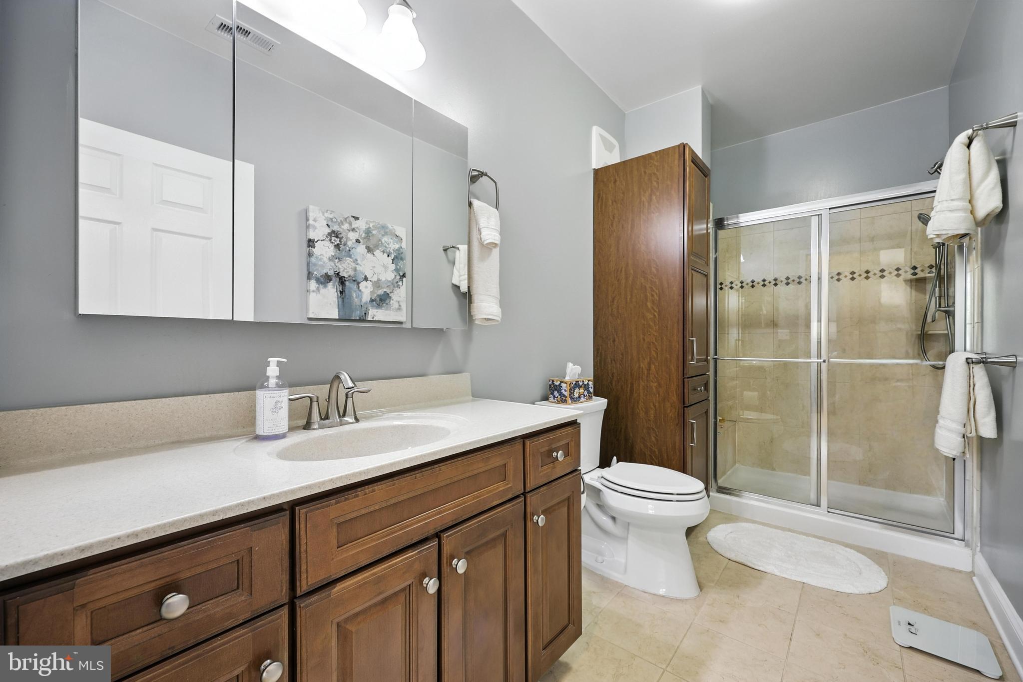 3910 Doc Berlin Drive, Unit 21 Silver Spring, MD 20906 - Photo 21 of 27 a bathroom with a sink toilet and shower
