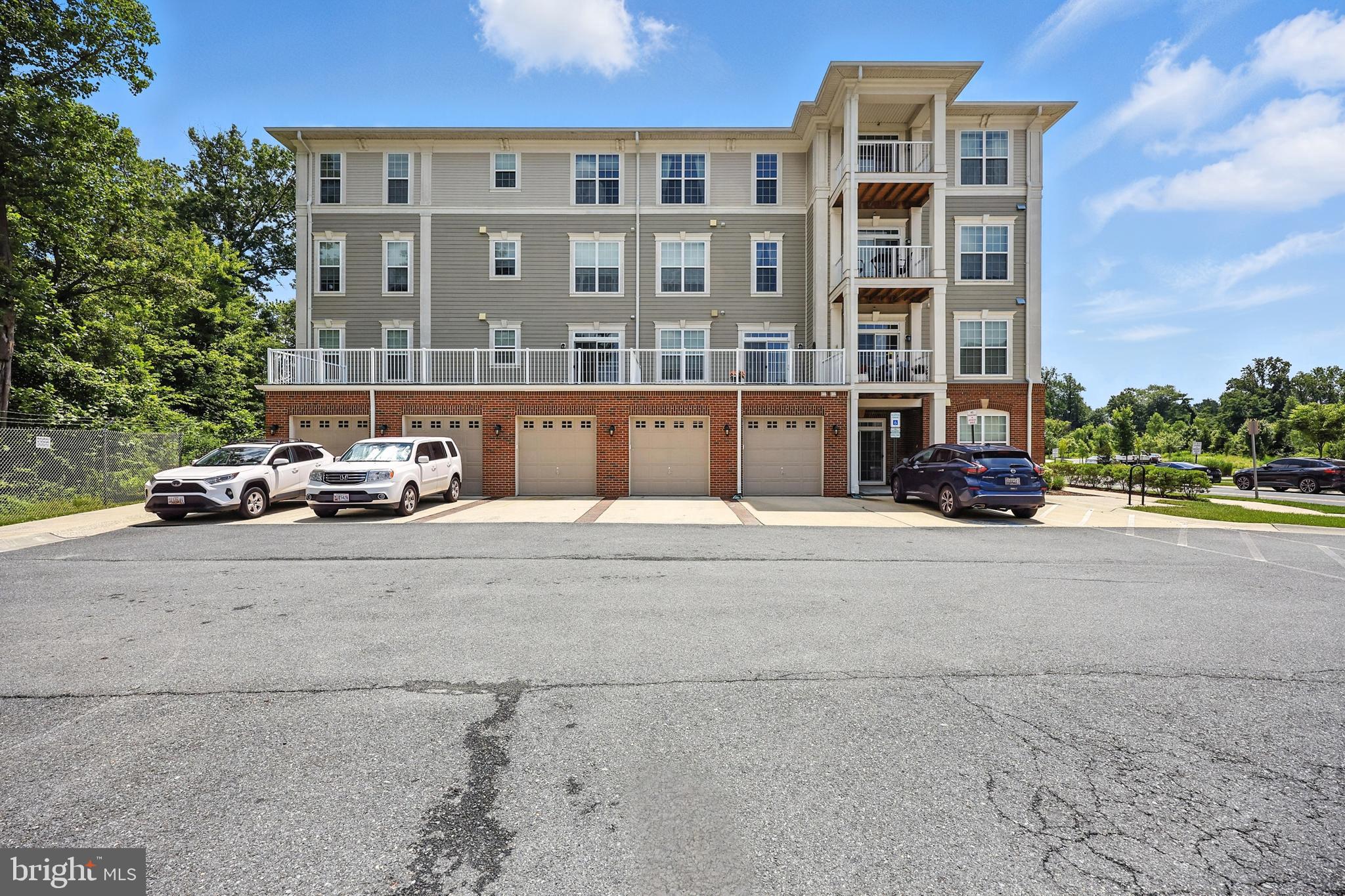 3910 Doc Berlin Drive, Unit 21 Silver Spring, MD 20906 - Photo 3 of 27 a car parked in front of a building