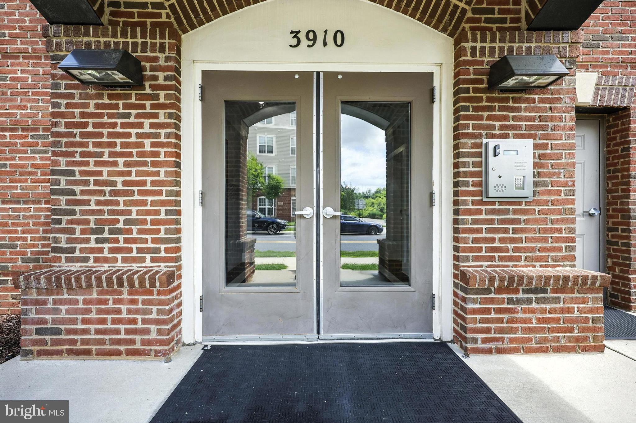 3910 Doc Berlin Drive, Unit 21 Silver Spring, MD 20906 - Photo 4 of 27 a view of front door of house and wooden floor