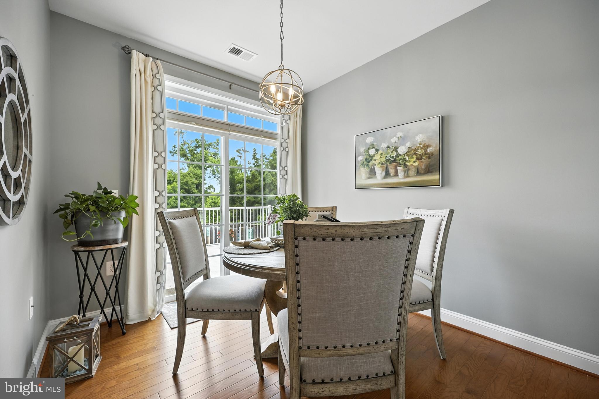 3910 Doc Berlin Drive, Unit 21 Silver Spring, MD 20906 - Photo 9 of 27 a view of a dining room with furniture window and outside view