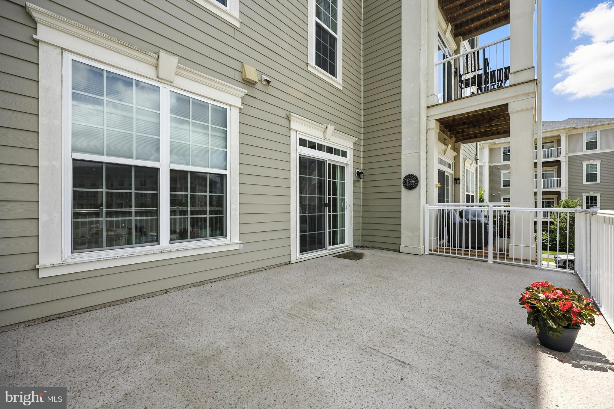3910 Doc Berlin Drive, Unit 21 Silver Spring, MD 20906 - Photo 10 of 27 a front view of a house with a yard