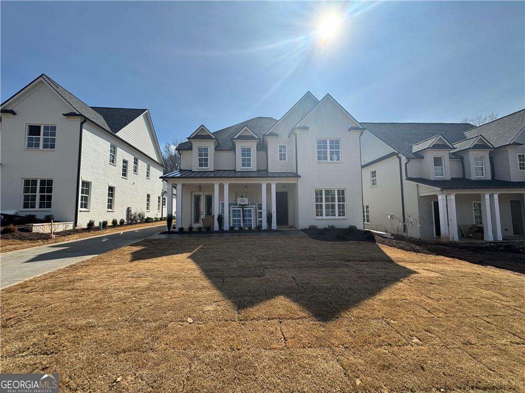 224 Suwanee Avenue Suwanee, GA 30024 - Photo 2 of 9 a front view of a house with a yard