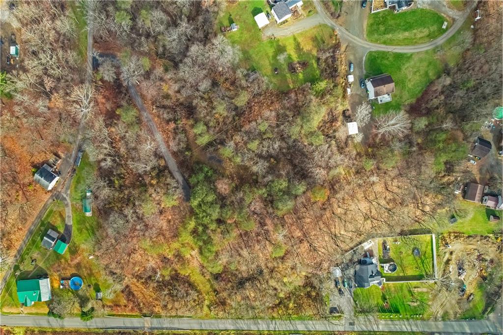 405 Jacoby Road Cheswick, PA 15024 - Photo 3 of 11 a backyard of a house with lots of green space