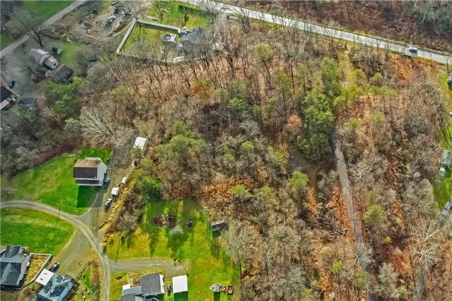 a aerial view of a house with a yard