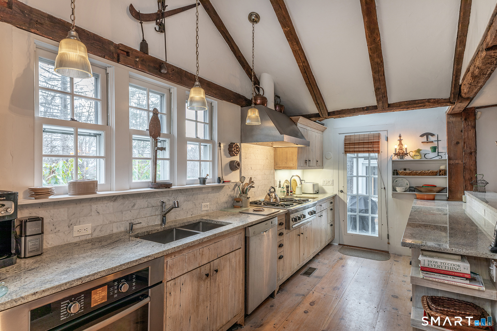 197 Skyline Ridge Road Bridgewater, CT 06752 - Photo 16 of 31 a kitchen with stainless steel appliances a sink a stove and a wooden floors