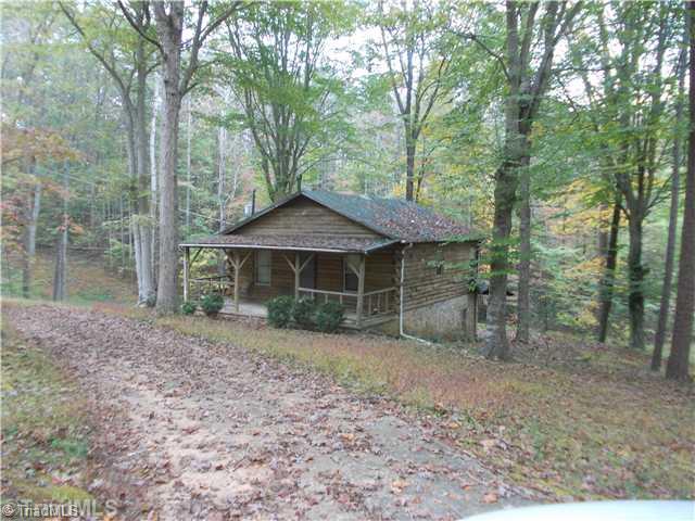 449 Golf Course Road Pilot Mountain, NC 27041 - Photo 1 of 13 Exterior Front. Secluded log cabin less than 1 mile from Pilot Knob Park Country Club