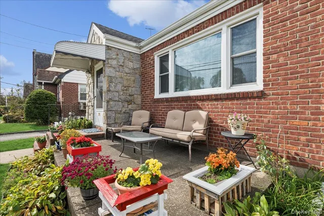 a front view of house with outdoor seating