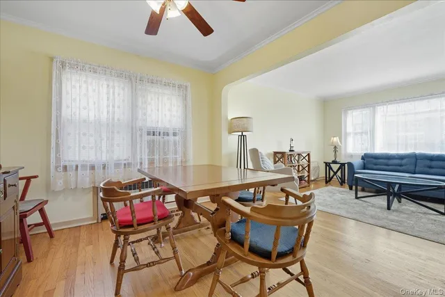a living room with furniture a table and a chandelier