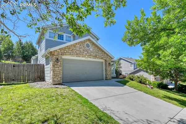 a front view of a house with a garage