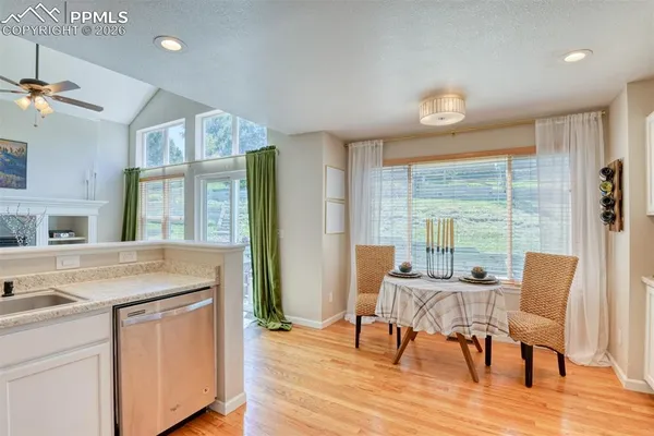 a view of a dining room with furniture window and wooden floor