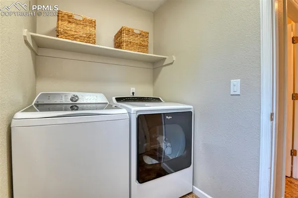 a bathroom with a sink and a mirror with toilet
