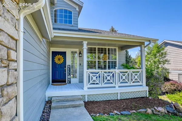 a view of a house with a porch and wooden floor