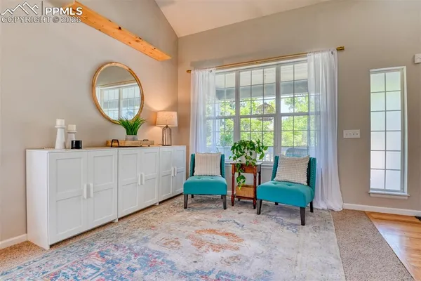a view of a livingroom with furniture and stairs