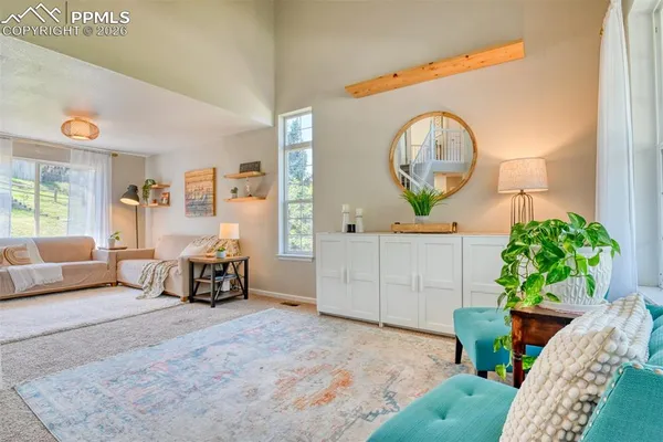 a living room with furniture and a window