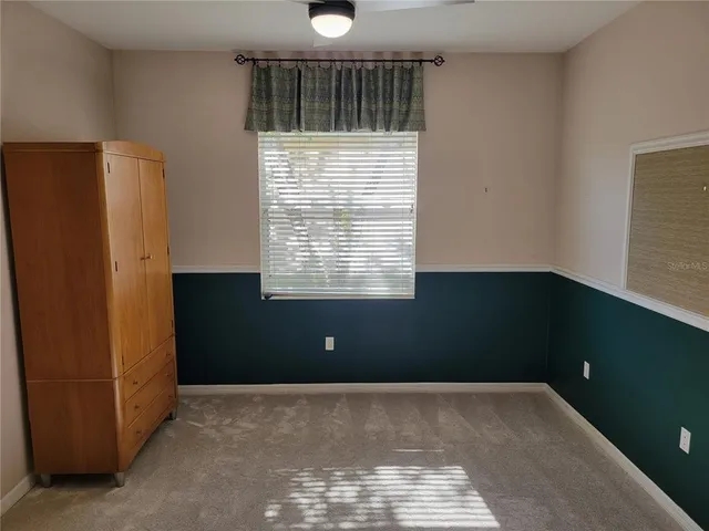 a kitchen with granite countertop a refrigerator and a stove