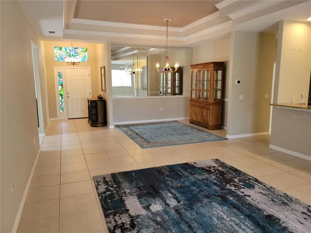 an aerial view of a house with a swimming pool outdoor seating and yard