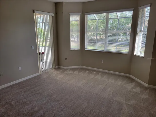 an aerial view of residential houses with outdoor space and river