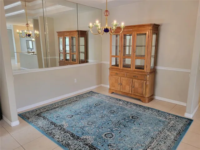 a bathroom with a granite countertop sink and bathtub