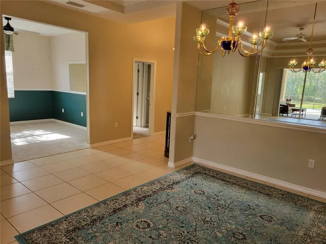 a kitchen with a sink and a wooden floor